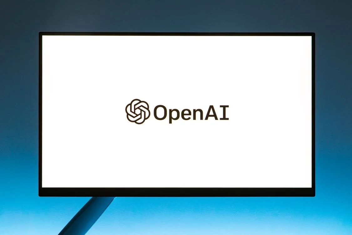 A general AI model displayed on a monitor, the kind of tool that has no concept of a client and no memory of your CRO testing framework