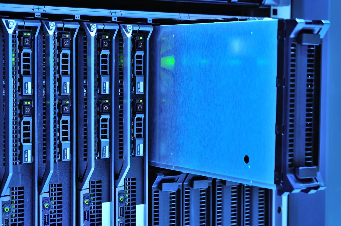 A single blue-lit server blade pulled out from a shared rack, representing Google Gemini reaching across your whole Workspace instead of keeping each client isolated