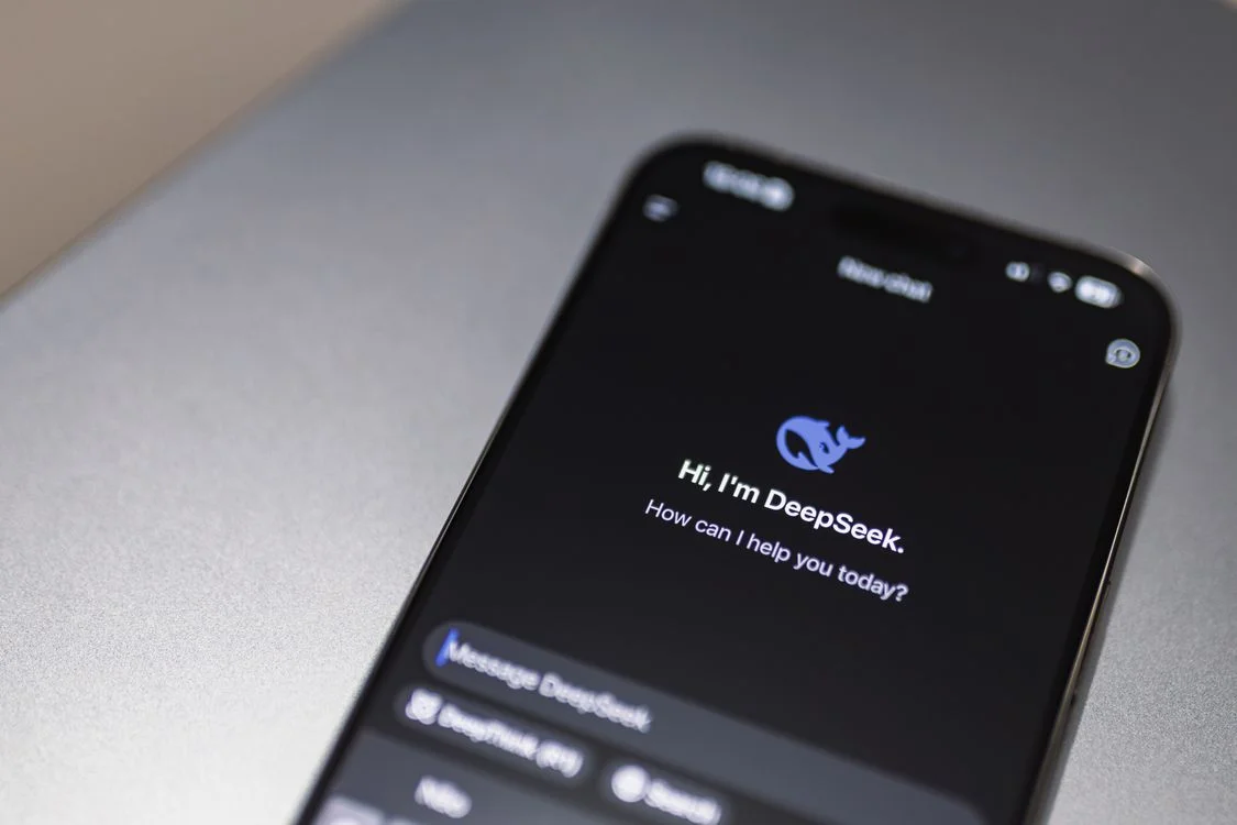 A smartphone screen showing a general AI chatbot interface, the default setup most direct response marketing consultants use before per-client workspaces