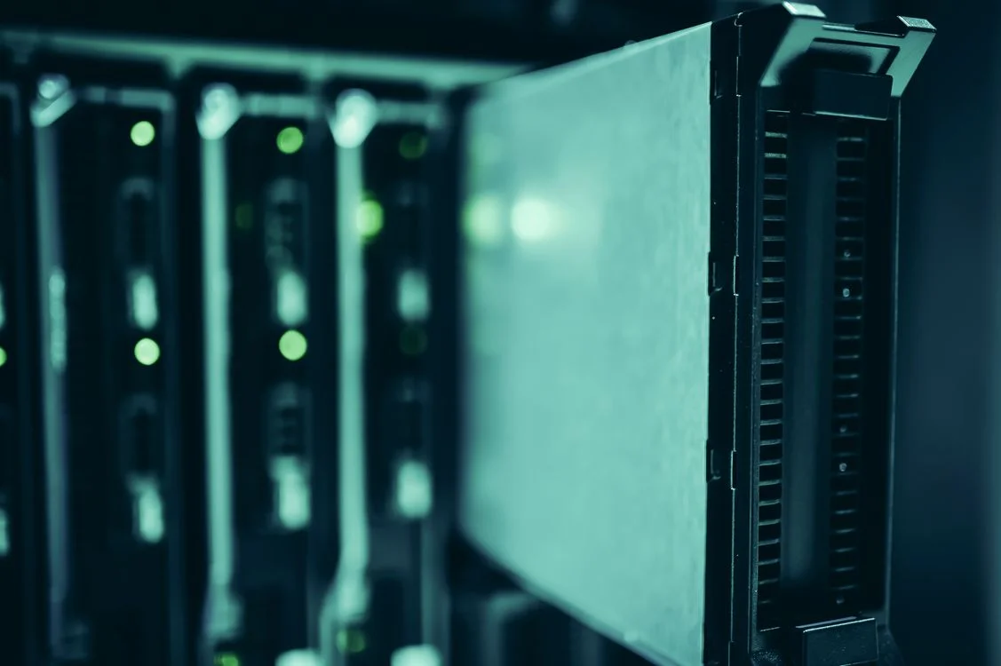 A single sealed server module lit in teal, representing a per-client AI workspace that keeps each client’s data isolated by design