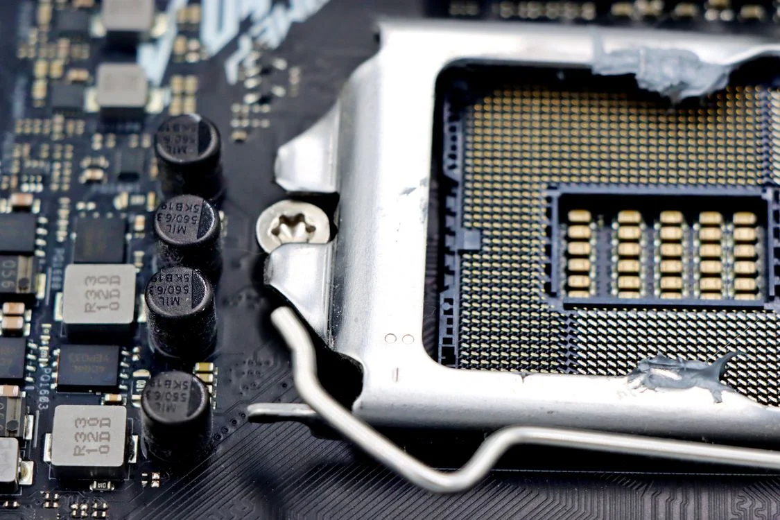 Close-up of a processor socket on a circuit board, the architecture layer that lets an AI system clone your expert methodology