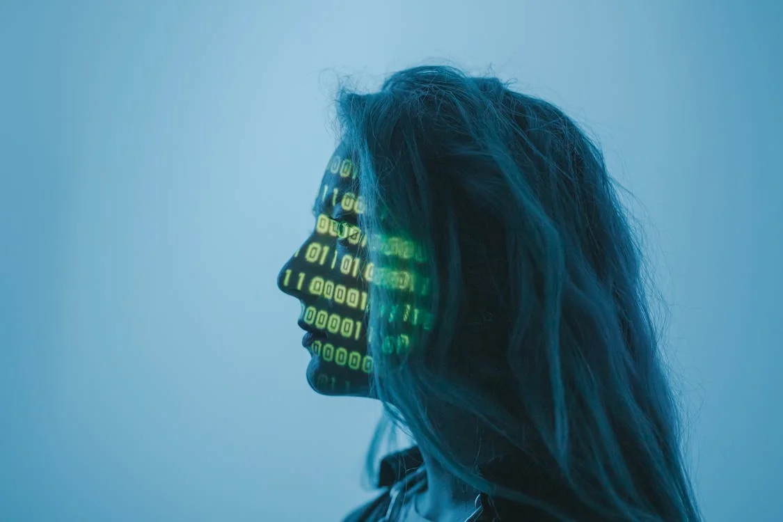 Silhouette with streams of binary code, representing an AI brain for a service business that turns the knowledge in your head into a usable system
