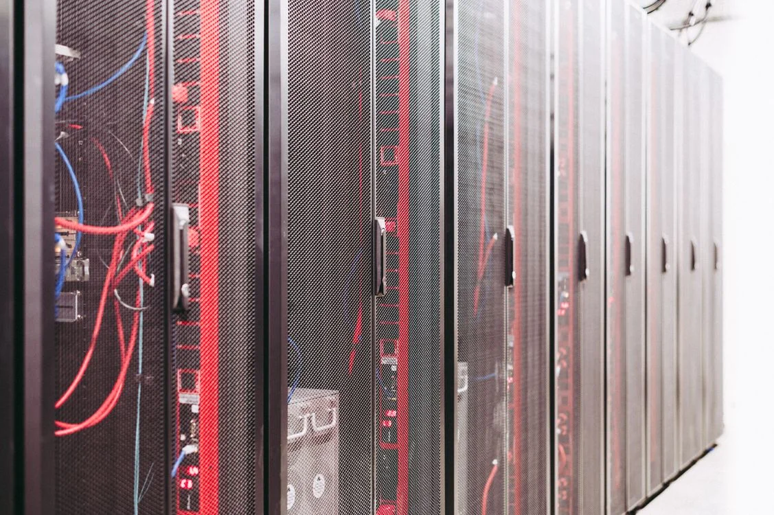 A row of sealed black server cabinets in a data centre, representing the structural separation that keeps client data isolated rather than pooled in one place