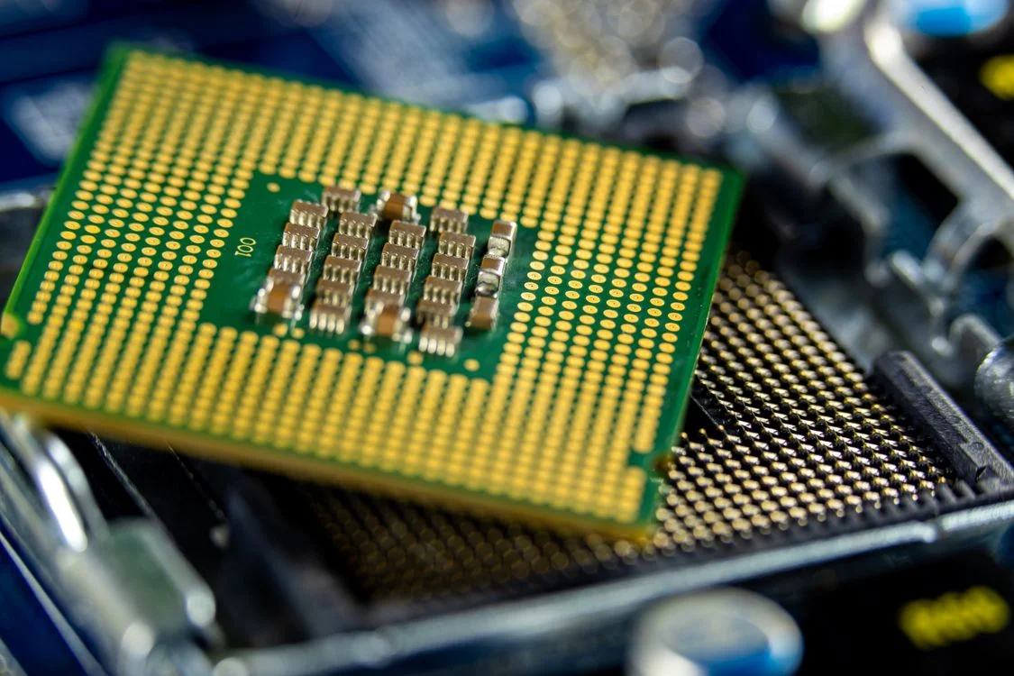 Macro view of a microprocessor on a motherboard, representing centralized intellectual property for consultants running as one system