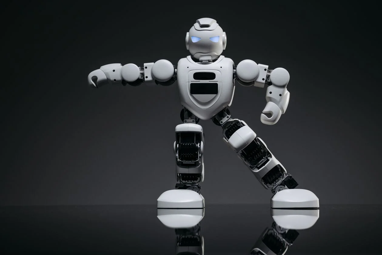 White humanoid robot in a dark studio, representing generic AI tools that handle client data without confidentiality built in