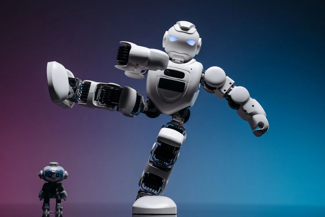 A large white robot positioned over a smaller robot in a studio, representing one methodology applied across many isolated client workspaces