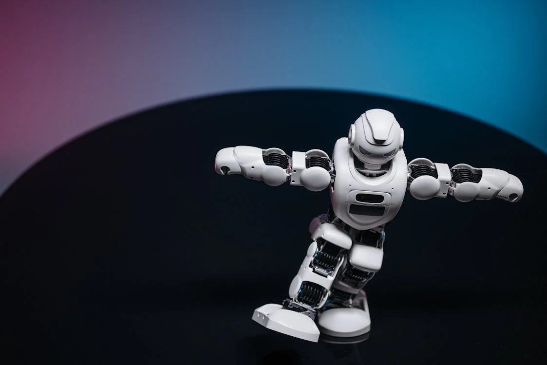 Close-up of a white robot, representing the AI brain that holds a consultant's frameworks and applies them across isolated client workspaces