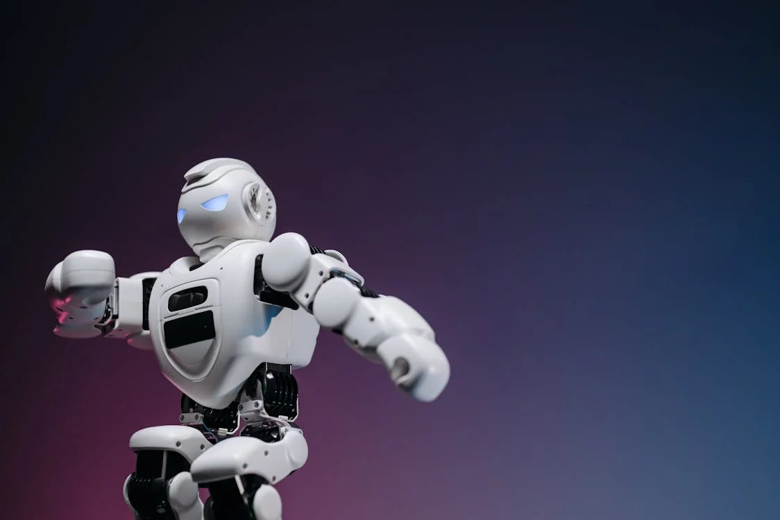 Close-up of a futuristic robot toy against a gradient background: the AI agent that applies your consulting methodology to every client