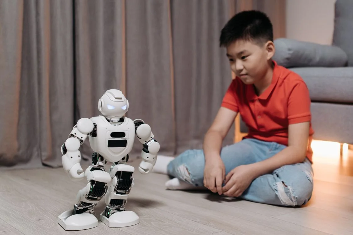 White humanoid robot in a dynamic pose, representing how to scale your methodology with AI across many clients at once