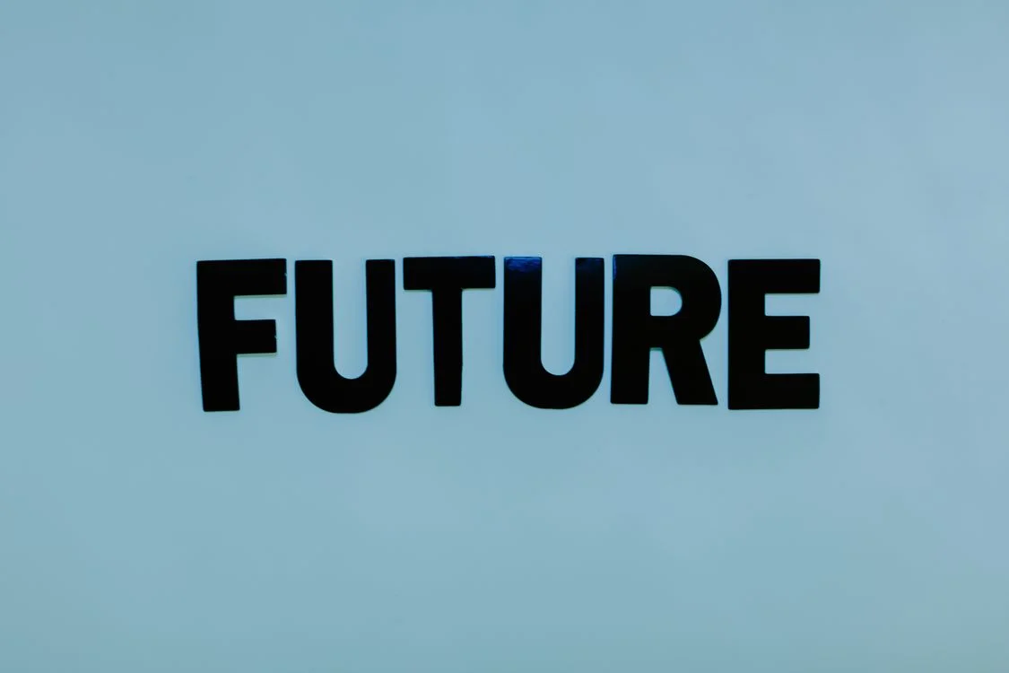The word FUTURE in bold black letters on a pale blue background, representing the shift to delivering your methodology to 100 clients through a system