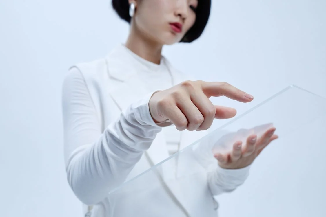 A person interacting with a transparent digital interface, representing AI for conversion rate optimization consultants applying one testing methodology to every client