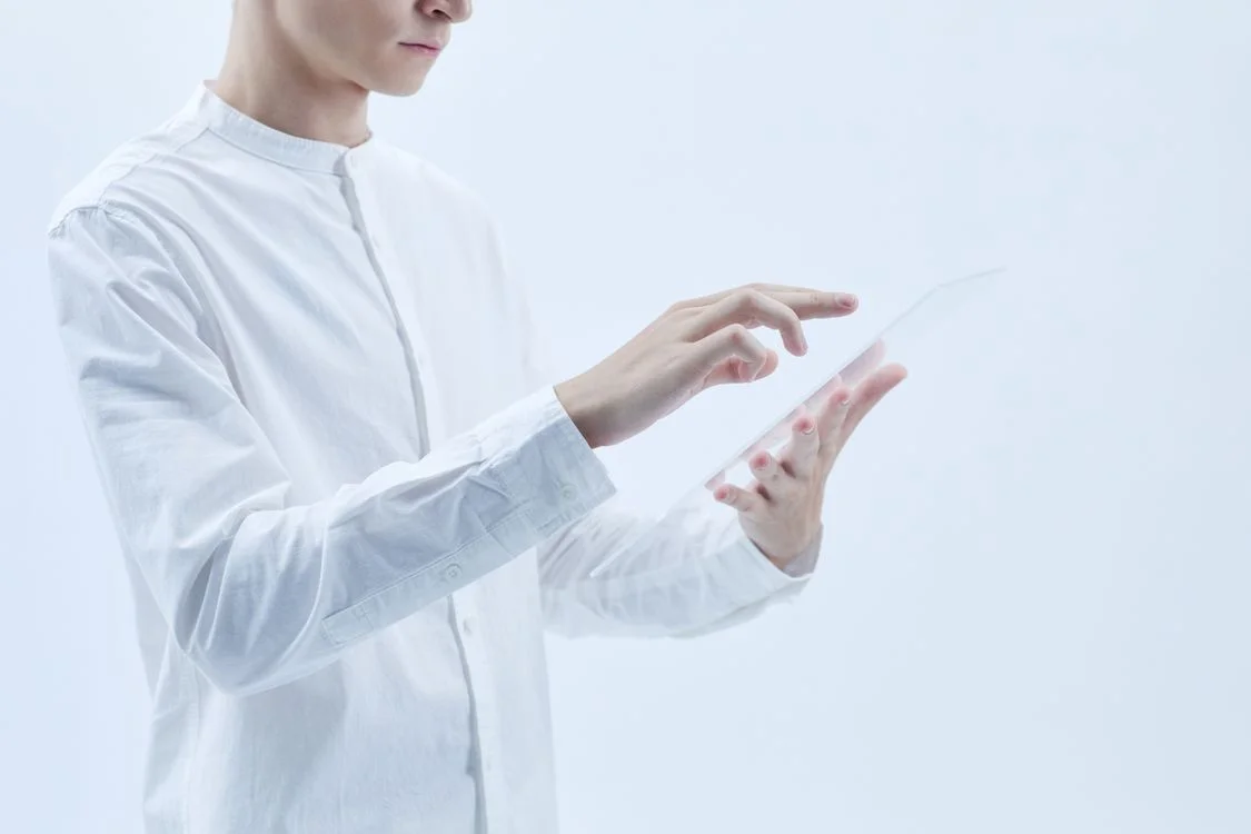 A person working on a clean transparent digital interface, representing a client-specific AI workspace that holds only one client's context