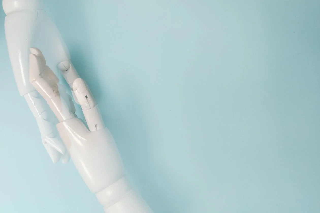Clean white robotic hand on a light background, representing precise, structured handling of client data in a GDPR-compliant AI workspace