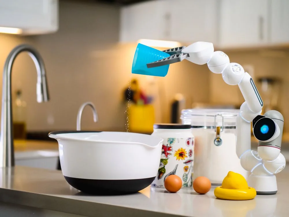 A robotic arm running a defined process step by step, the repeatable half of delivery that replaces the course model in coaching